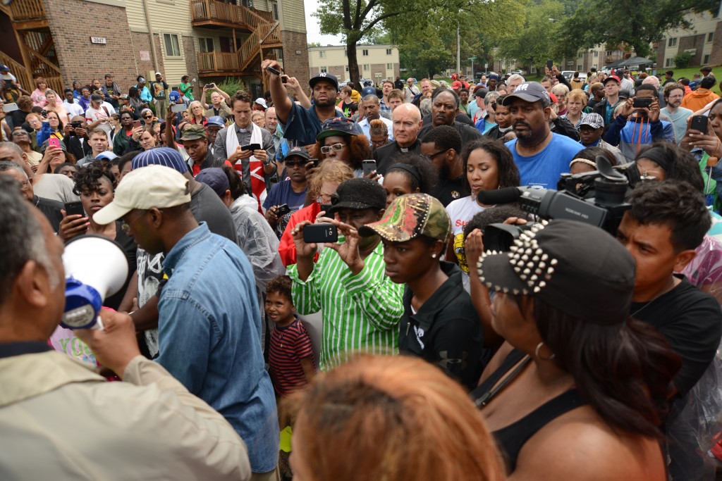 Rev. Jesse Jackson addresses the rally at the site where Michael Brown, Jr., was killed. Photo by ELLEN DAVIDSON