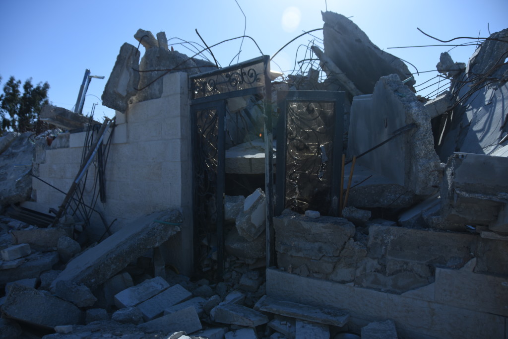 A glass and wrought-iron door is all that's left of this entryway.